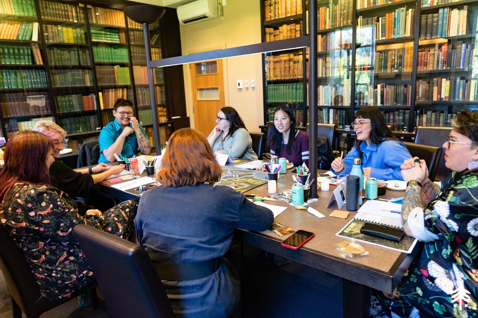 Eight founders gathered around a table at The Leaders' Table, deep in a workshop session